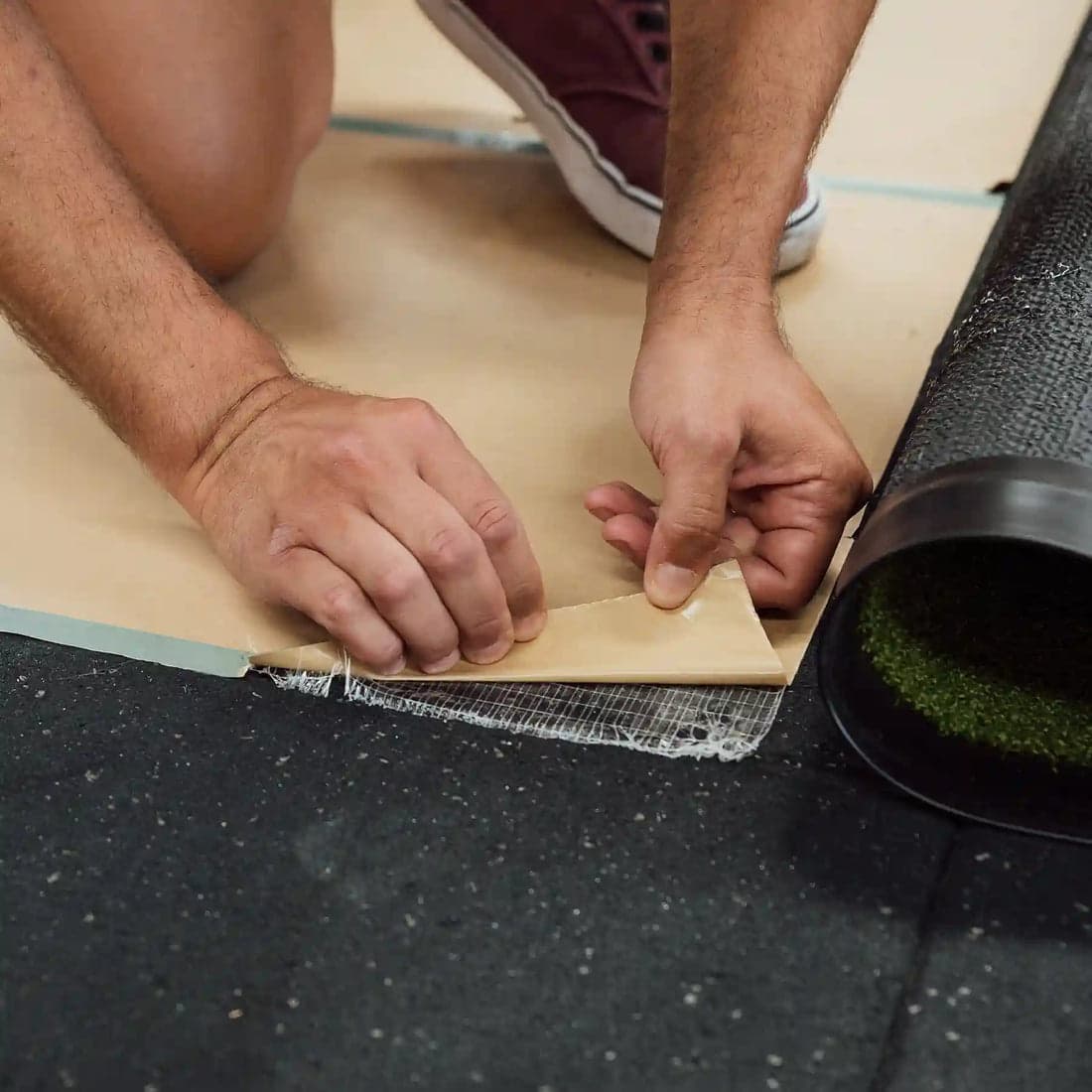 Rolling the track onto double-sided adhesive tape