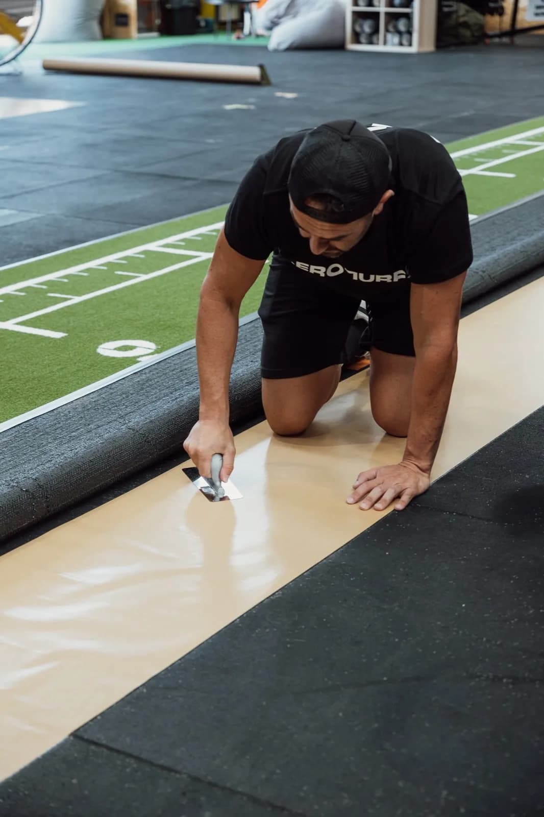 Applying double-sided installation tape with a spatula